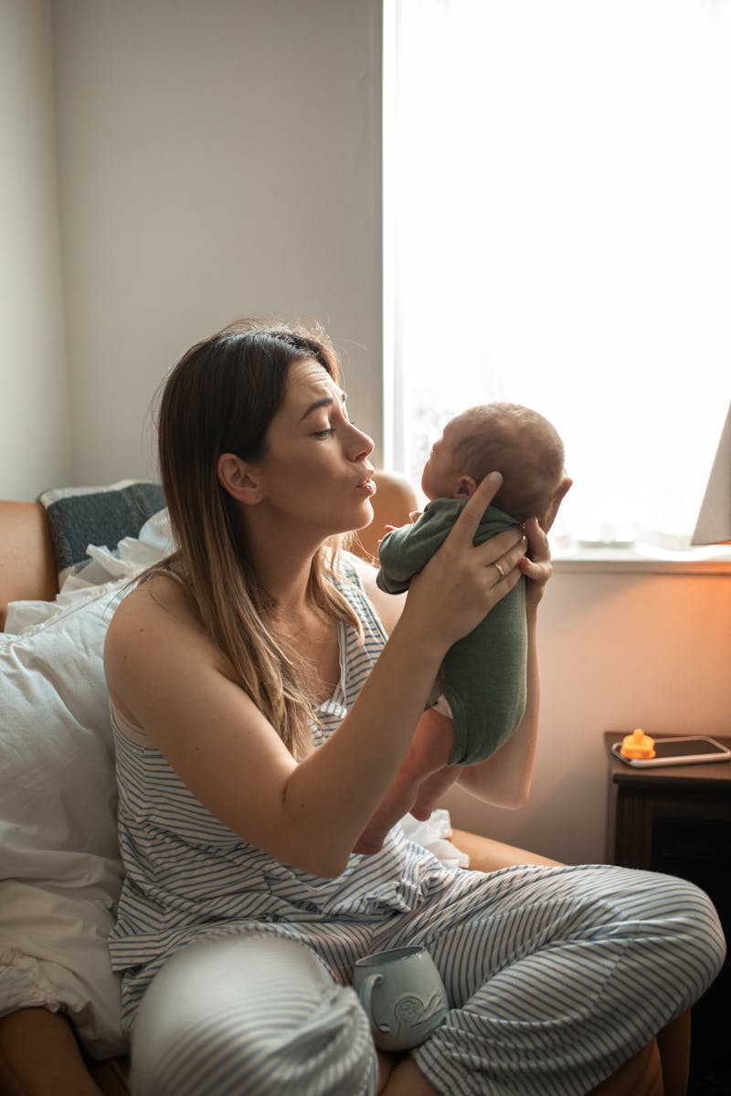 Woman Carrying Her Baby