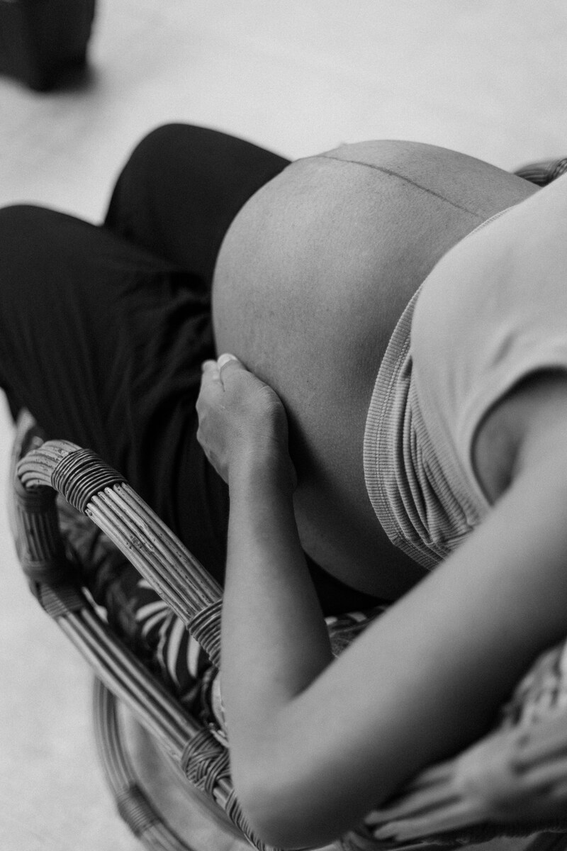 A black and white photo of a pregnant woman photo