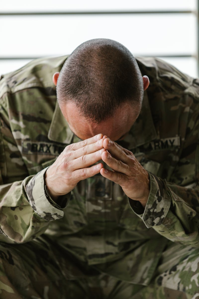 Photo of Man with his Head Leaning on his Hands