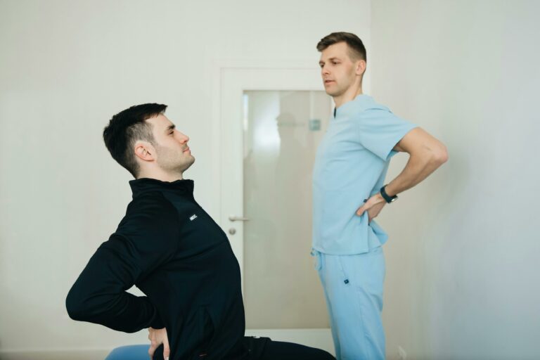 Physiotherapist Instructing a Patient on How to Exercise