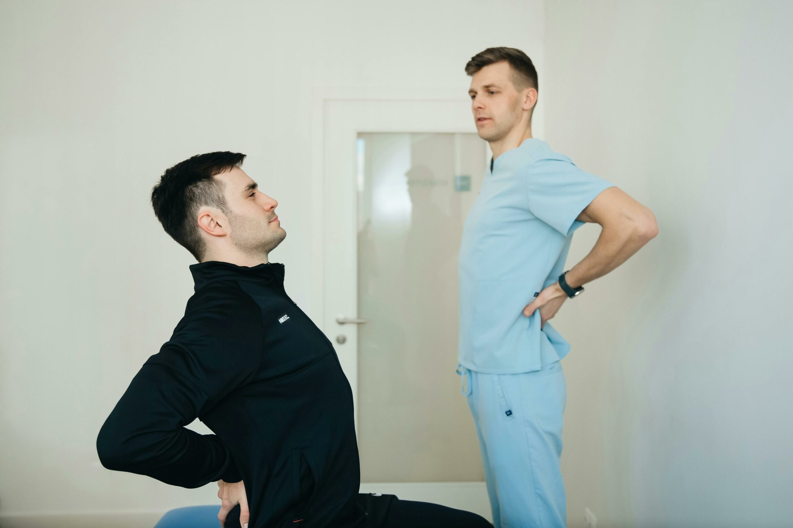 Physiotherapist Instructing a Patient on How to Exercise