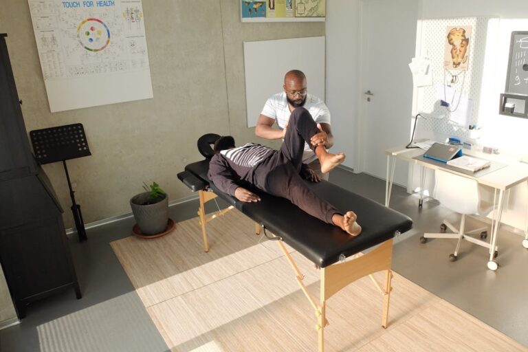 Therapist performing therapeutic massage in a clinic setting, emphasizing wellness and relaxation.