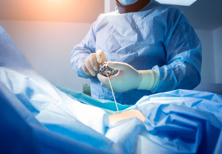 Surgeon performs endoscopic microdiscectomy of herniated intervertebral disc